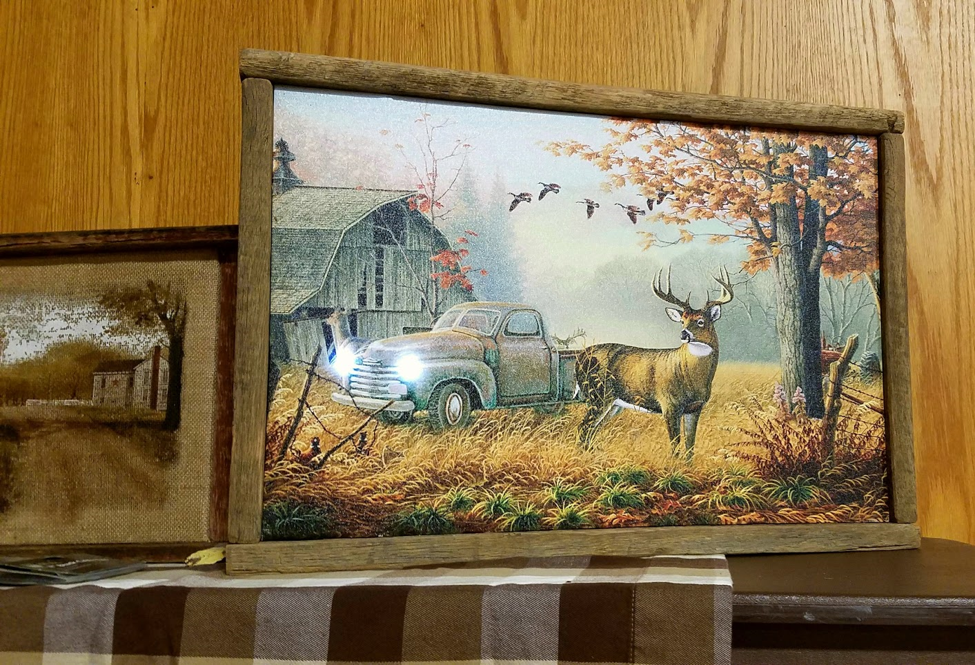 deer and a pick up